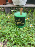 Handmade Small Green Colored Candle with Honeysuckle and Mint Scent. Candle is 18.75 oz with Wooden Wick.