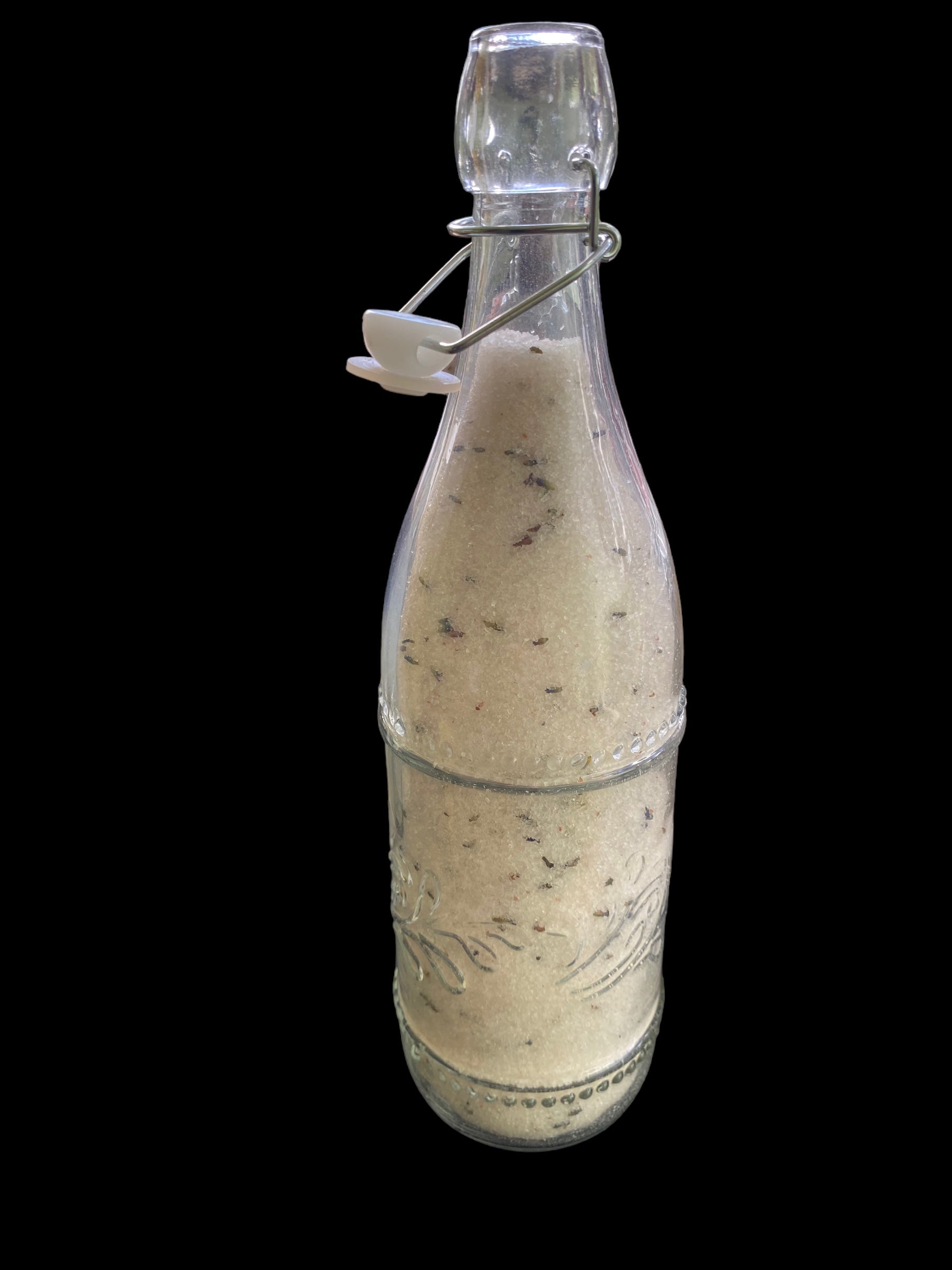 Beautiful Clear Vintage Bottle filled with Epsom Salt Pink Sea Salt Jojoba Sunflower Olive Shae Butter Oils and Scented with Rosemary Geranium Tea Tree Eucalyptus Essential Oils with Blends of Lavender Flowers.