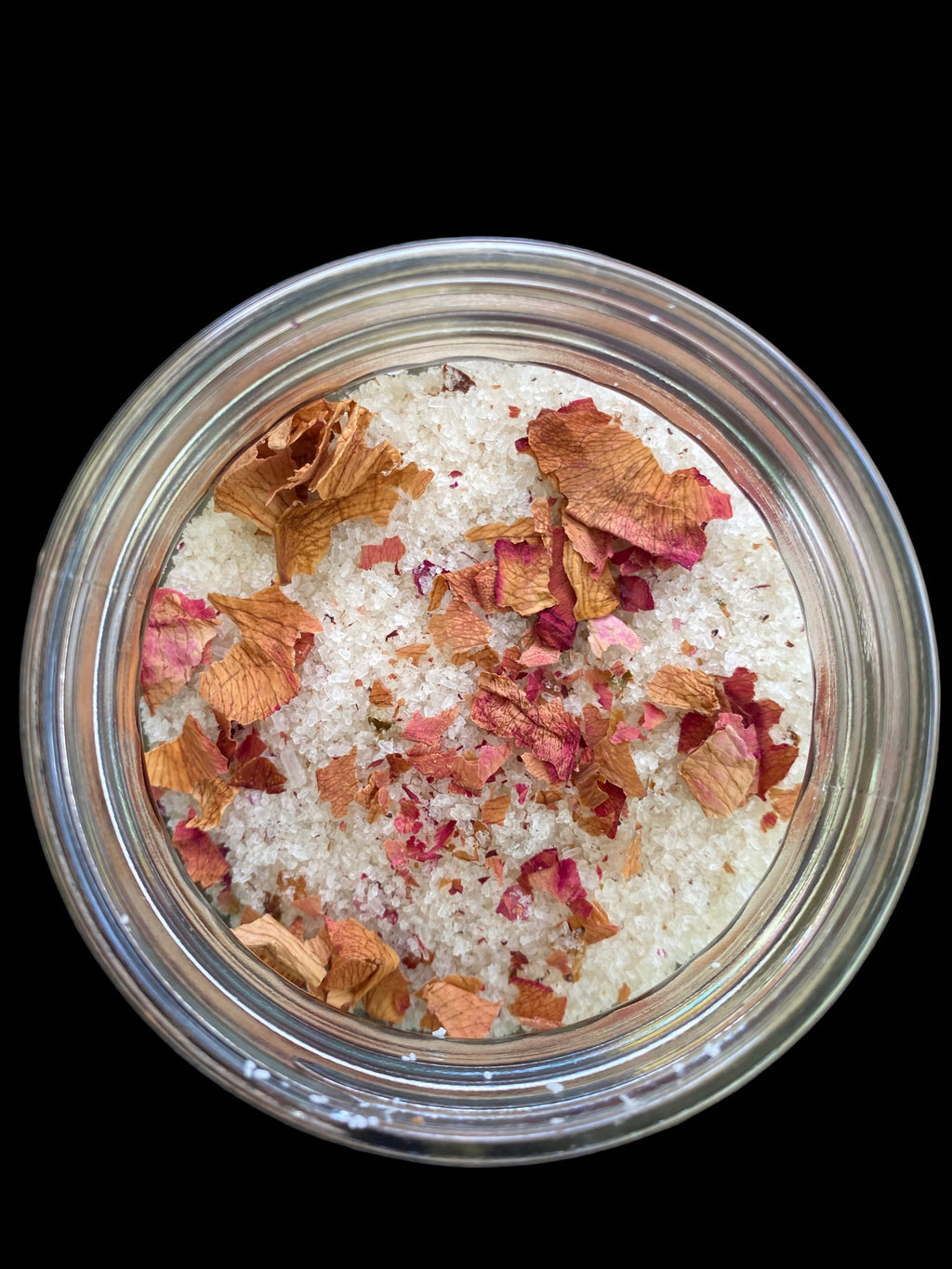 Clear Vintage Mason Jar Filled with Lavender Sweet Orange Tea Tree and Geranium Essential Oils has Dead Sea Salt Pink Himalayan Sea Salt has Olive Jojoba Sunflower and Shae Butter Oils. Blended with Rose Petals.