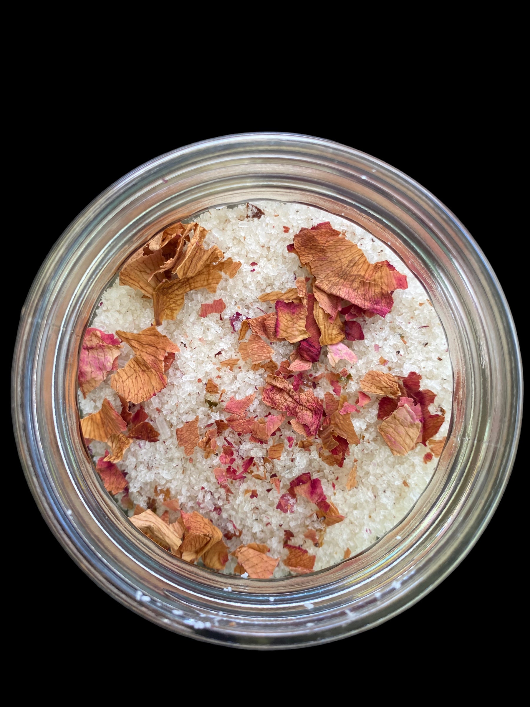 Clear Vintage Mason Jar Filled with Lavender Sweet Orange Tea Tree and Geranium Essential Oils has Dead Sea Salt Pink Himalayan Sea Salt has Olive Jojoba Sunflower and Shae Butter Oils. Blended with Rose Petals.
