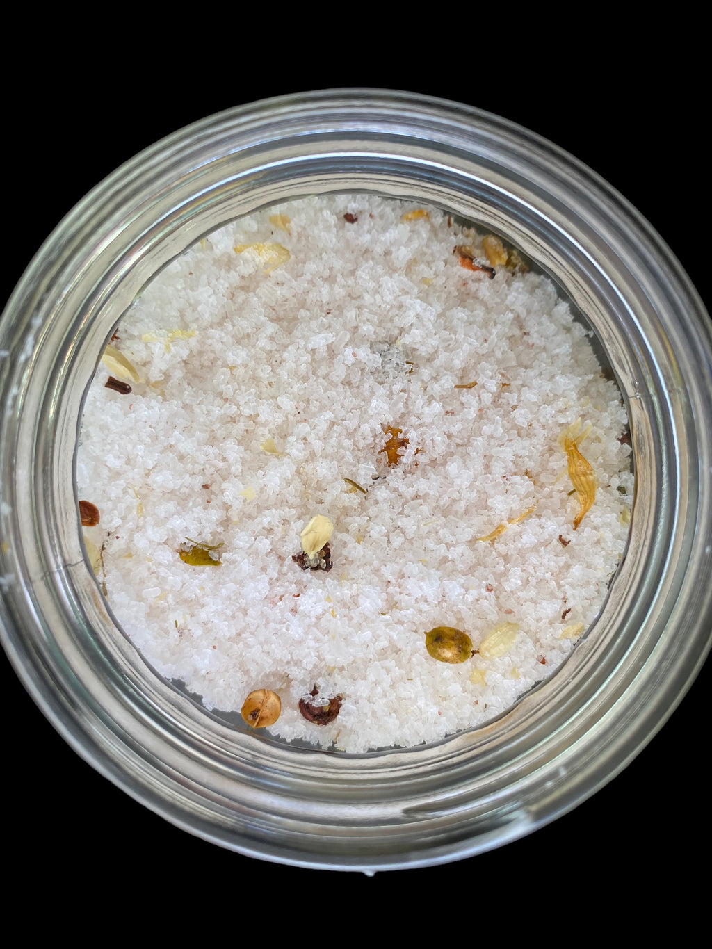 Clear Vintage Mason Jar Filled with Clove Lavender Chamomile Tea Tree and Geranium Essential Oils has Dead Sea Salt Pink Himalayan Sea Salt has Olive Jojoba Sunflower and Shae Butter Oils. Blended with Albizzide Flowers.