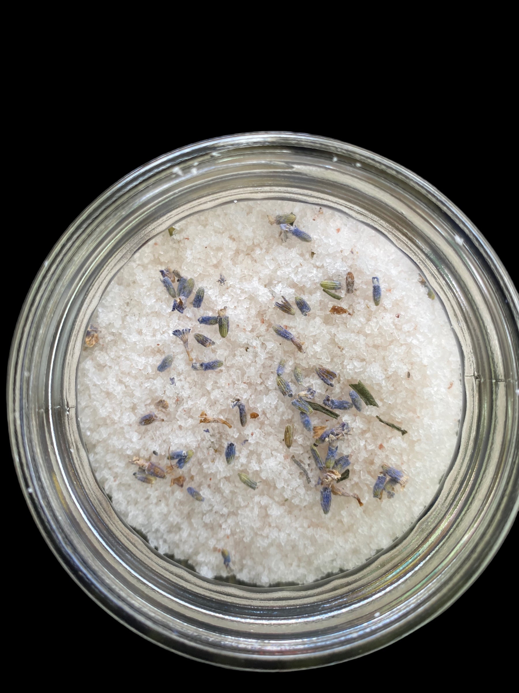 Clear Vintage Mason Jar Filled with Clove Lavender/Chamomile Tea Tree and Geranium Essential Oils has Dead Sea Salt Pink Himalayan Sea Salt has Olive Jojoba Sunflower and Shae Butter Oils. Blended with Lavender Flowers 