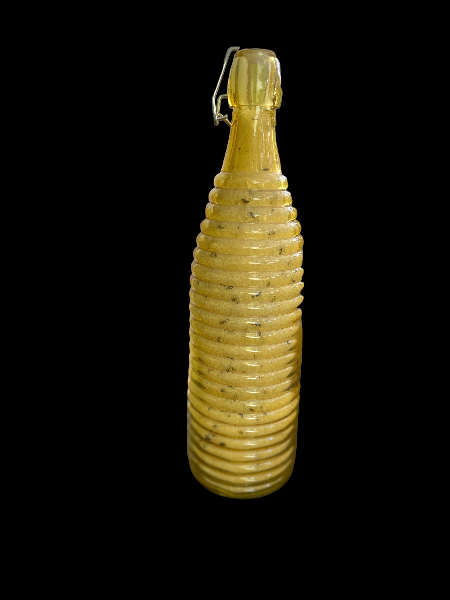 Large Orange Vintage Bottle with Pressure Snap has Bath Salts made with Natural Organic Products such as Epsom Pink Himalayan Sea Salt Baking Soda Shae Butter Jojoba Olive Oils with Albizzide and Lavender Flowers Tangerine and Tea Tree Geranium Oil.