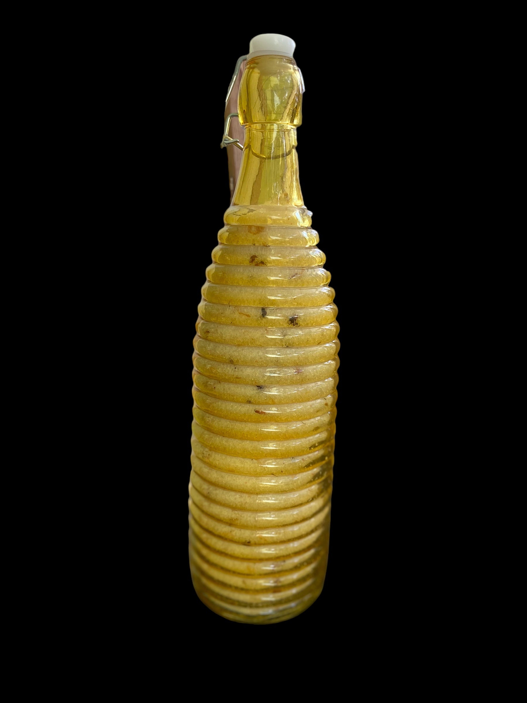 Large Orange Vintage Bottle with Pressure Snap has Bath Salts made with Natural Organic Products such as Epsom Pink Himalayan Sea Salt Baking Soda Shae Butter Jojoba Olive Oils with Lavender Flowers Lavender Sweet Orange Tea Tree Geranium Oil.