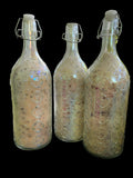 Vintage Tri-color Glass Bottles Filled with Epsom Salt Pink Sea Salt Jojoba Sunflower Olive Shae Butter Oils has Geranium Bergamot Cedarwood Clary Sage and Lavender Essential Oils and has 3 Different Blends Rose Petals Lavender or Calendula/Rose Petals.