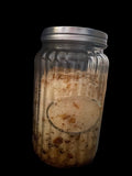 Clear Vintage Mason Jar Filled with Clove Lavender Chamomile Tea Tree and Geranium Essential Oils has Dead Sea Salt Pink Himalayan Sea Salt with Olive Jojoba Sunflower and Shae Butter Oils. Blends of Roses Jasmine and Albizzide Flowers.