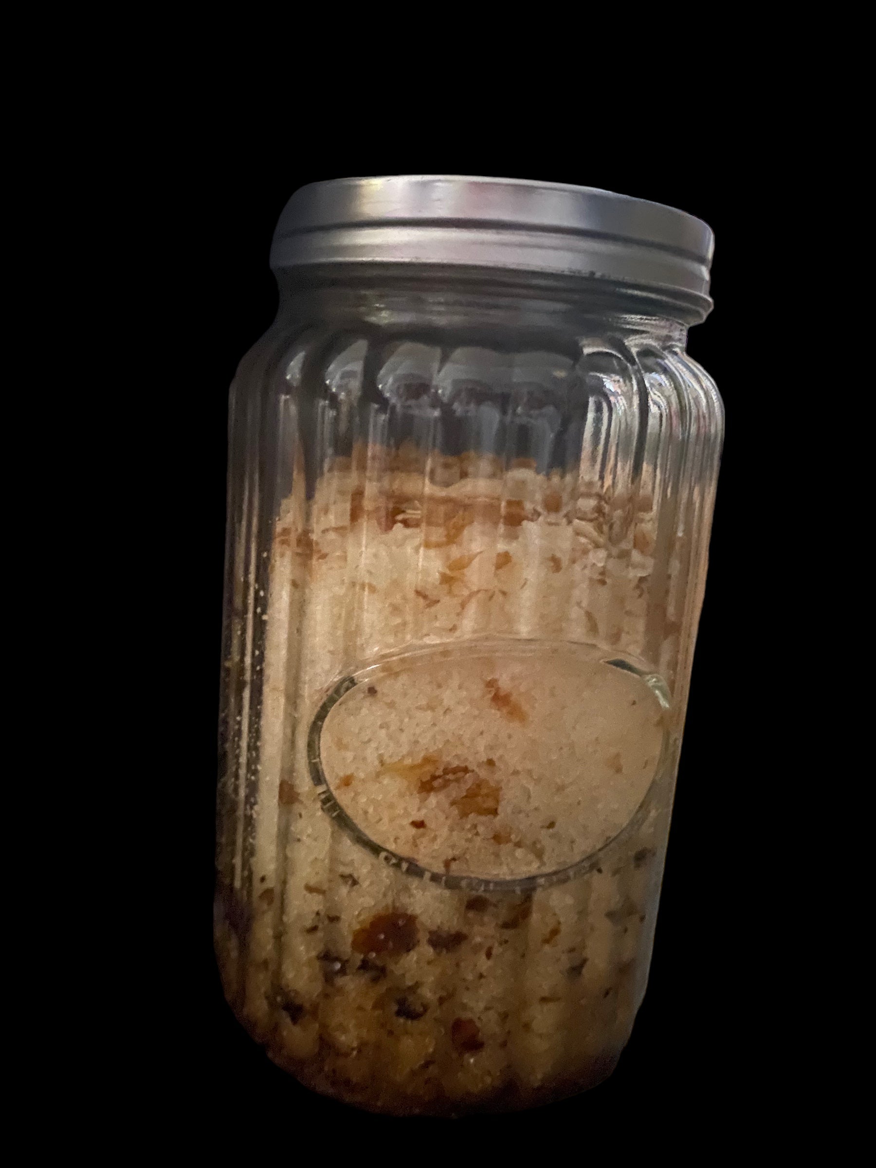 Clear Vintage Mason Jar Filled with Clove Lavender Chamomile Tea Tree and Geranium Essential Oils has Dead Sea Salt Pink Himalayan Sea Salt with Olive Jojoba Sunflower and Shae Butter Oils. Blends of Roses Jasmine and Albizzide Flowers.